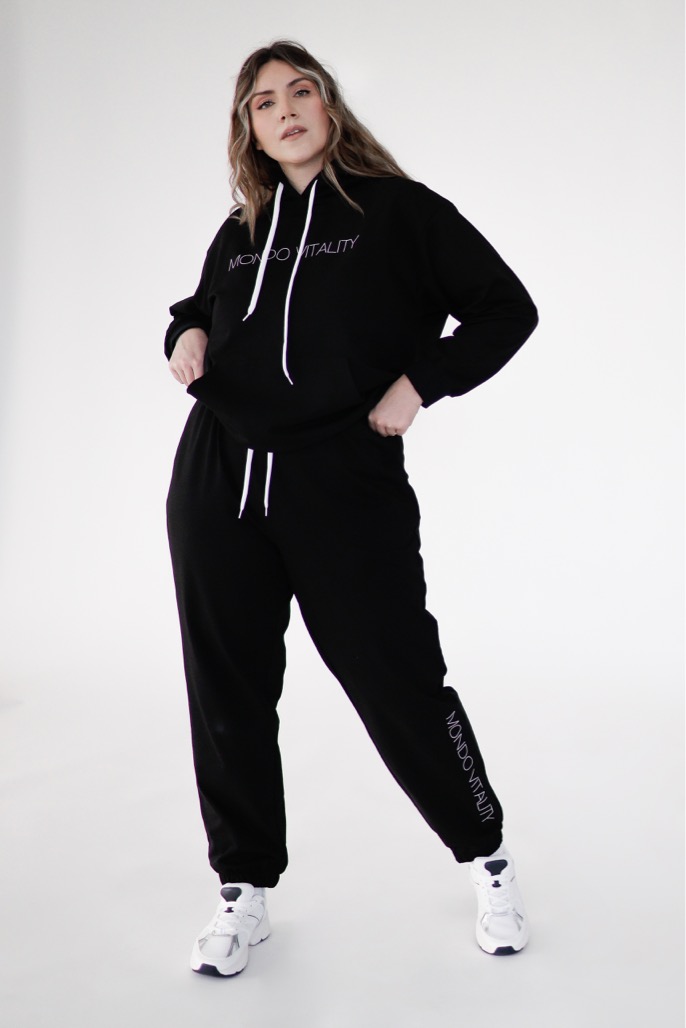 Plus size joggers from cotton blend in black colour from the front