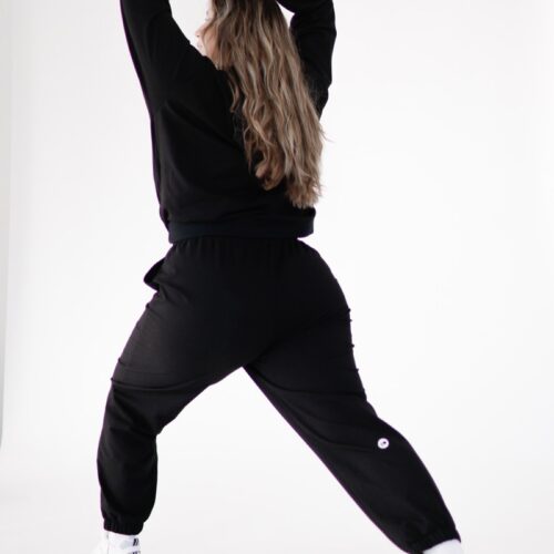 Plus size joggers from cotton blend in black colour from the back