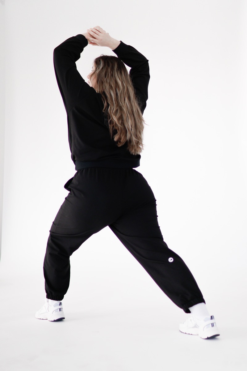 Plus size joggers from cotton blend in black colour from the back