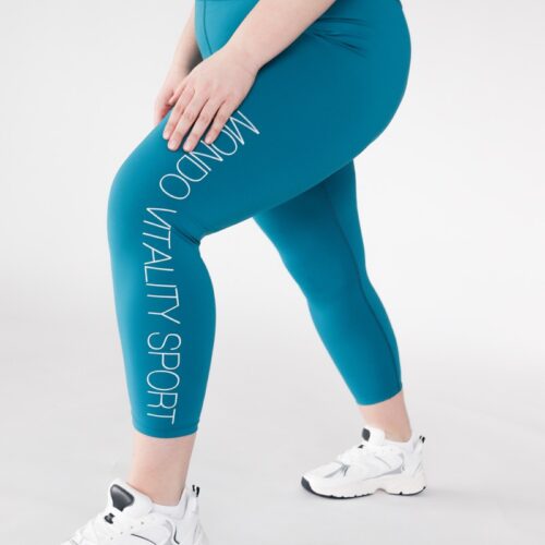 Plus size compression leggings from recycled polyamide and elastane in turquoise colour logo view