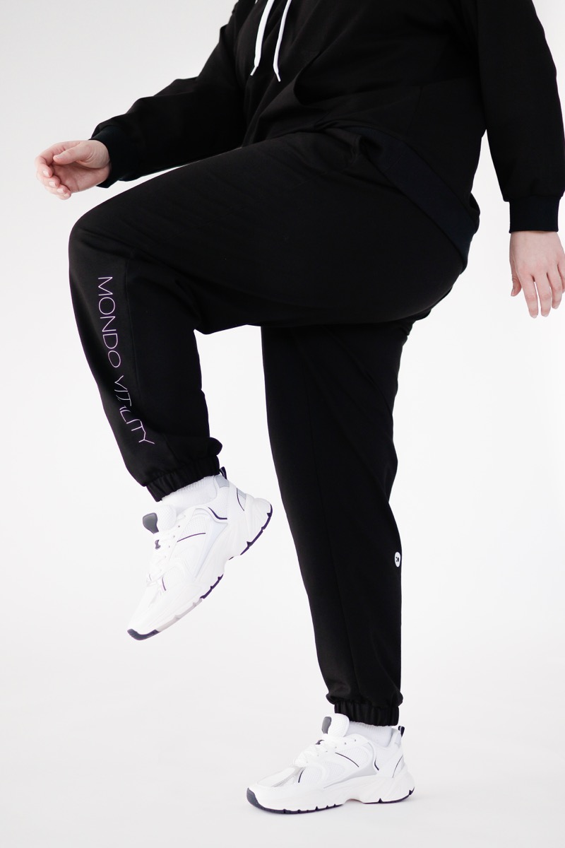 Plus size joggers from cotton blend in black colour in the movement